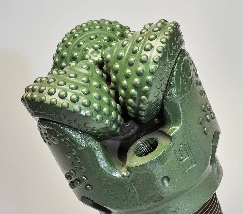 TCI tricone drill bit with sealed bearing and tungsten carbide insert buttons.