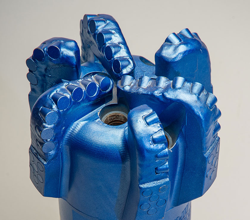 Blue PDC drill bit with polycrystalline diamond cutters