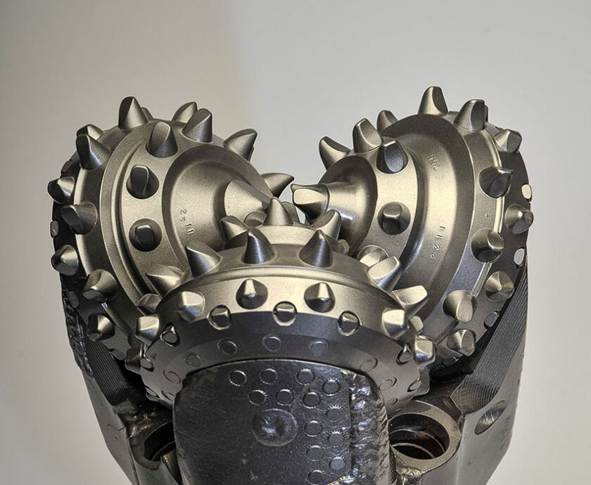 Front view of TCI tricone drill bit with sealed bearing and tungsten carbide insert cutters.