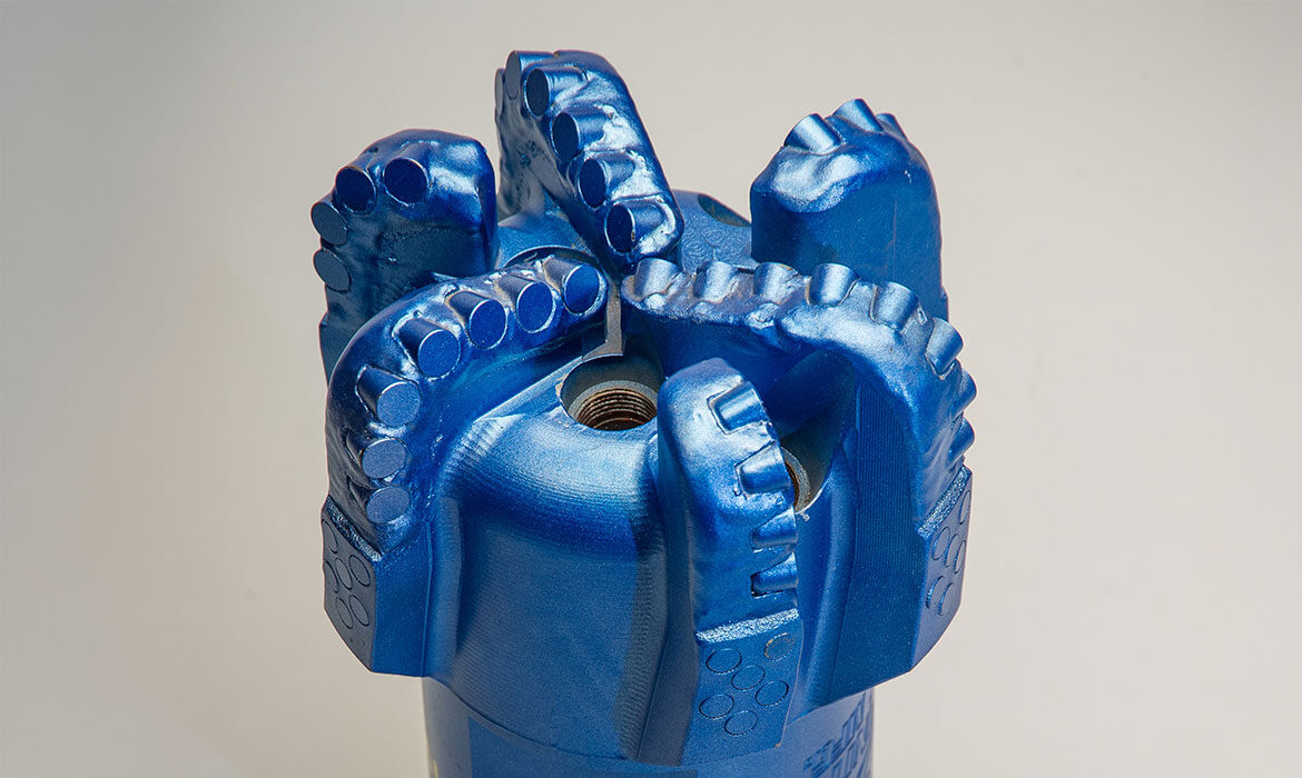 Blue PDC drill bit with polycrystalline diamond cutters