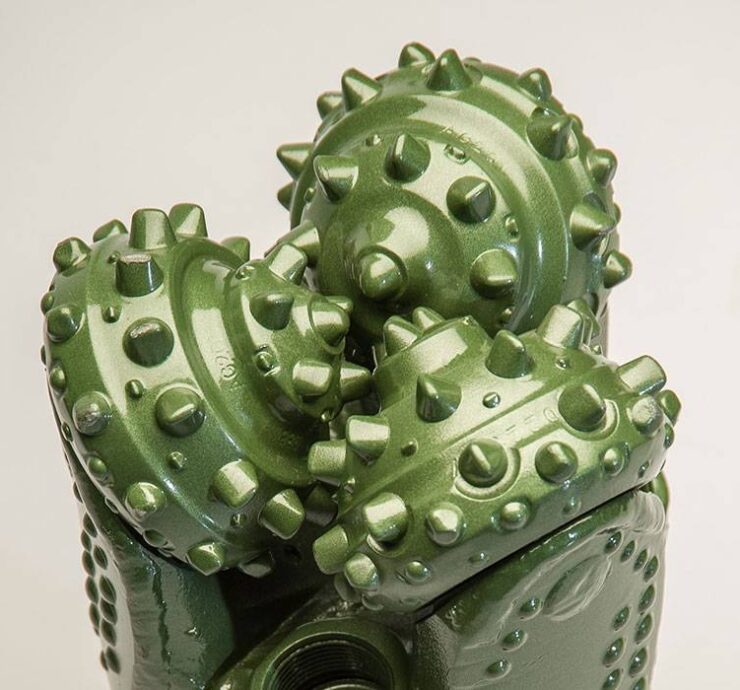 Green tricone drill bit with tungsten carbide insert cutters