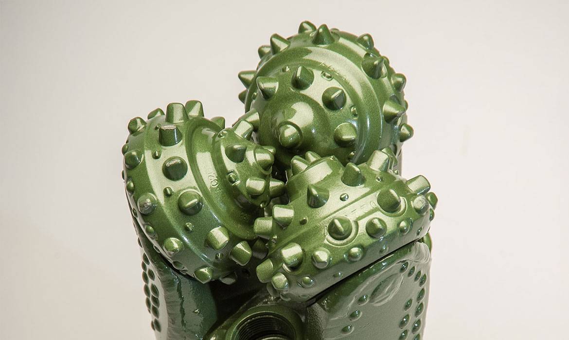 Green tricone drill bit with tungsten carbide insert cutters