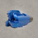 Angled side view of blue PDC drill bit with polycrystalline diamond cutters and threaded shank
