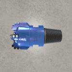Blue PDC drill bit with diamond cutters and threaded shank.