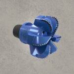 Side view of blue PDC drill bit with cutting blades and threaded connection.