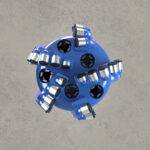 Front view of blue PDC drill bit with multiple polycrystalline diamond cutters.