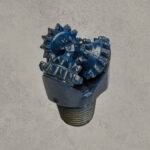 Mill tooth tricone drill bit with open bearing and steel milled teeth.