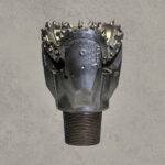 Front view of TCI tricone drill bit with sealed bearing and tungsten carbide insert cutters.